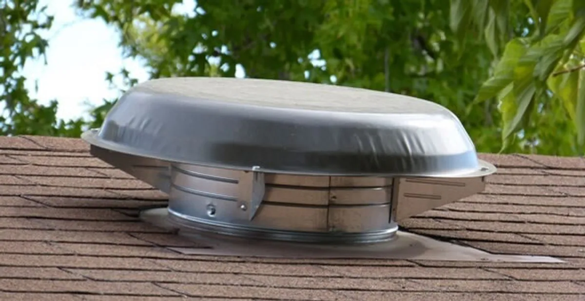 attic fan installation services with low-profile roof ventilation unit in Indianapolis, IN