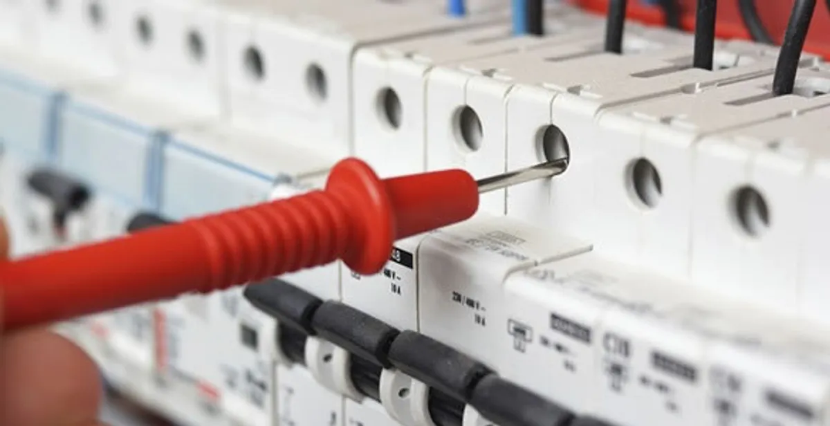 Electrical contractor testing circuit breakers during electrical repair in Brownsburg, IN