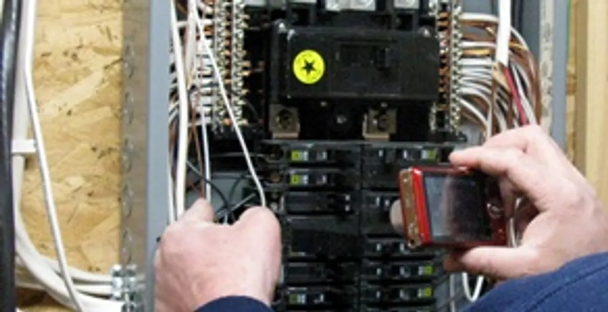Home electrical inspection of circuit breaker panel by licensed electrician in Indianapolis, IN