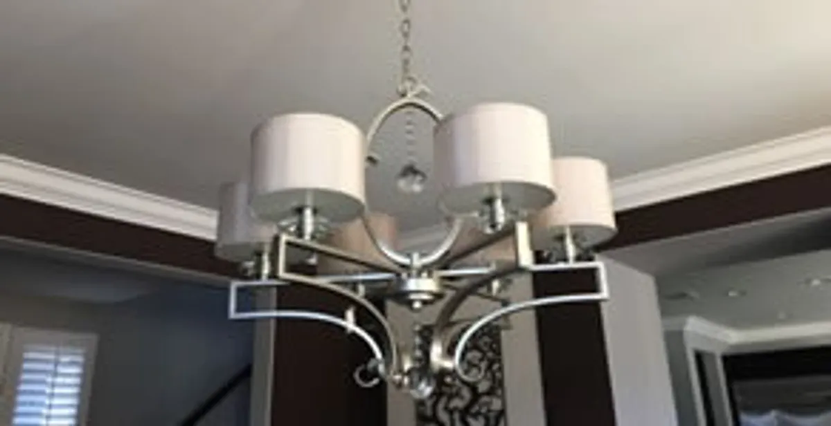 Modern chandelier installation with multiple light fixtures in Indianapolis, IN